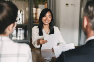 An applicant at a job interview, perhaps wondering, Do bankruptcies show up on background checks?